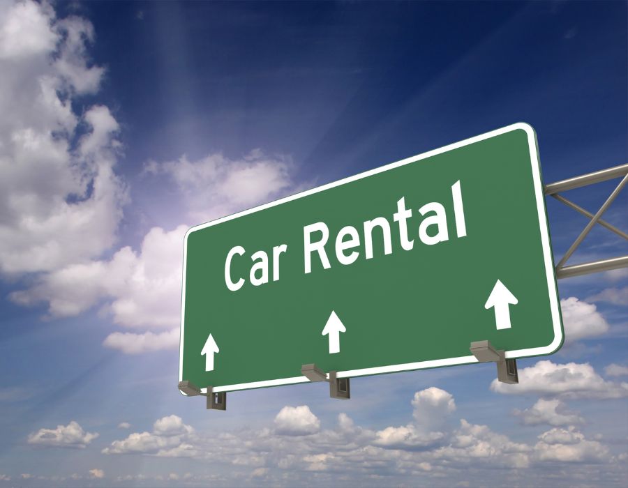 car rental ahead sign