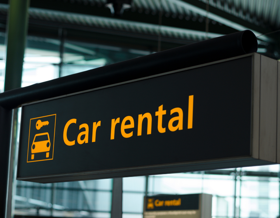 car rental sign at an airport