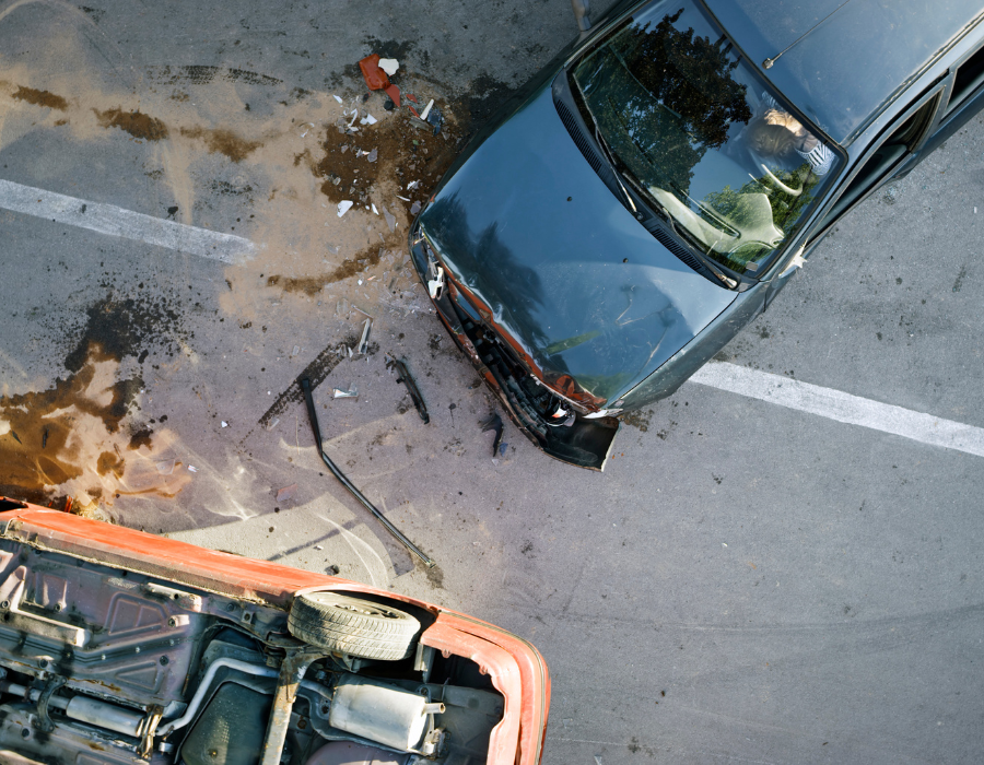 fatal car accident with oil and sand on road