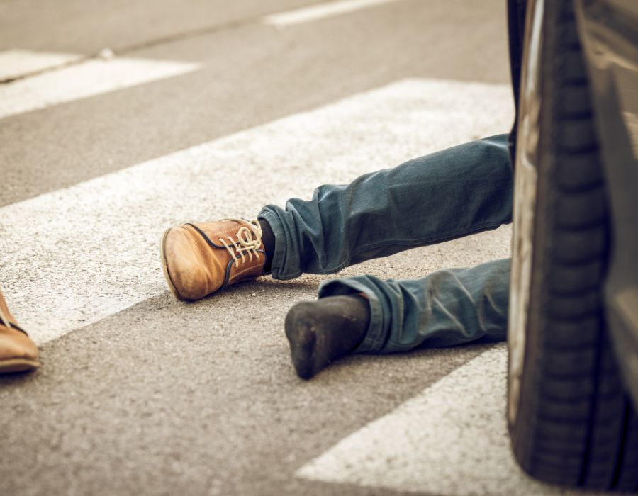 man hit by car on ground