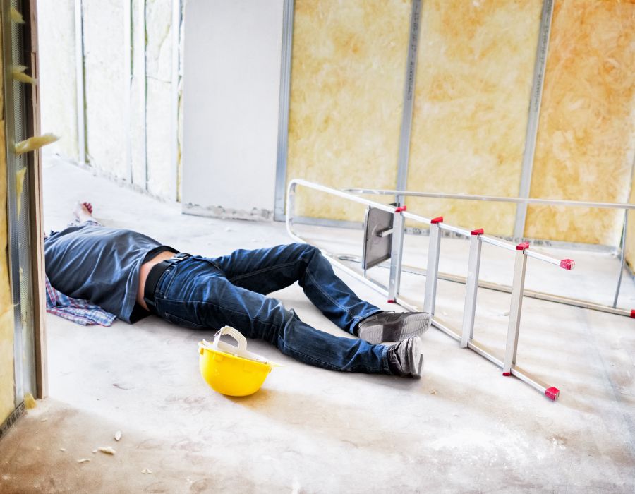 man on ground after falling off of ladder