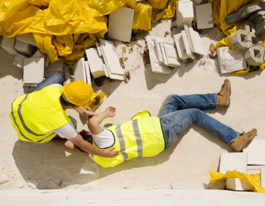 man on ground from construction site fall