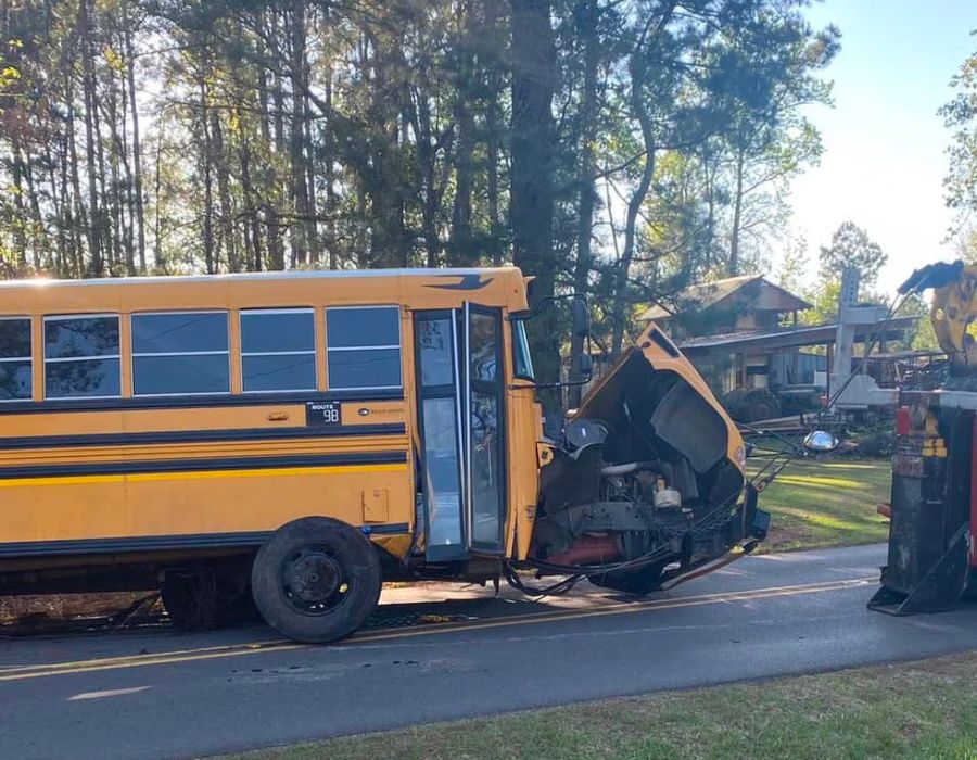 school bus broken down on the side of the road