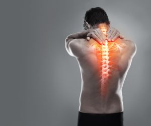 man with a red spine to signify pain - Baton Rouge Catastrophic Injury Lawyer