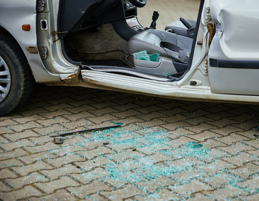 crashed van with glass on ground