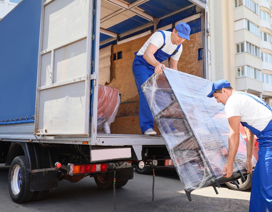 delivery truck drivers unloading large cargo