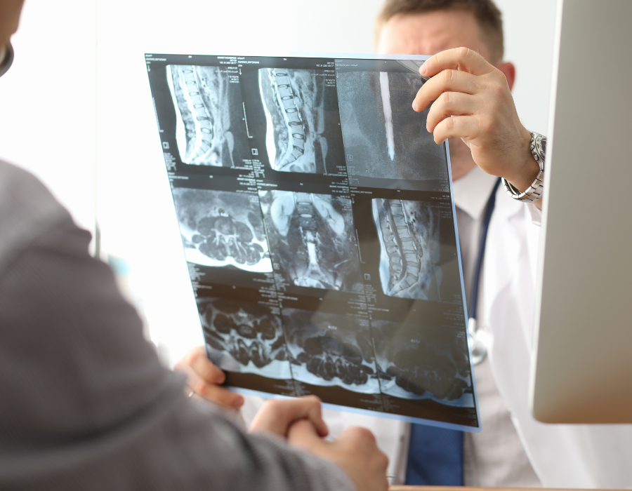 doctor showing patient broken bone xray