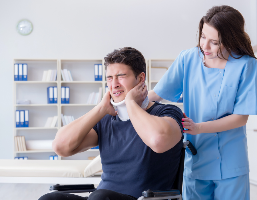 man wincing in pain from injuries