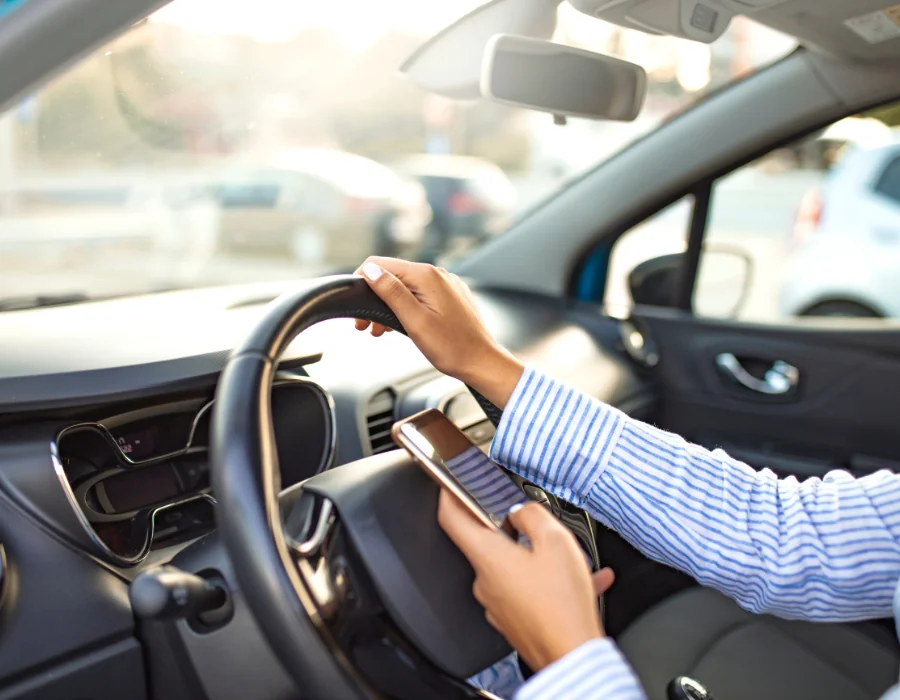 person texting and driving