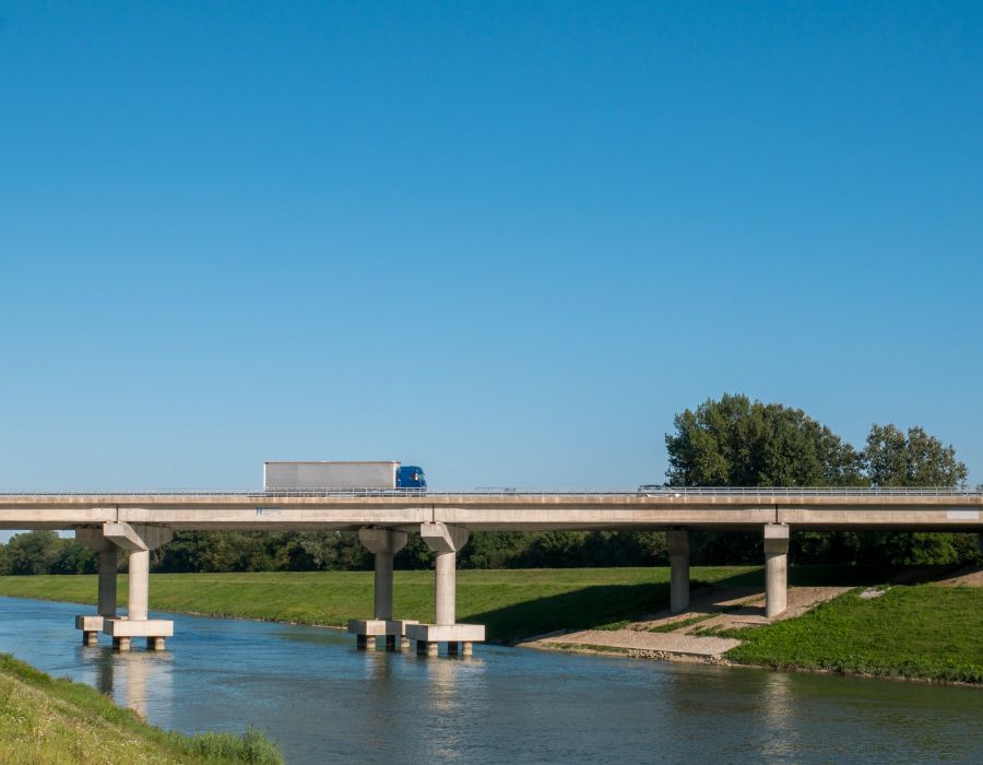 semi-truck driving on basin bridge