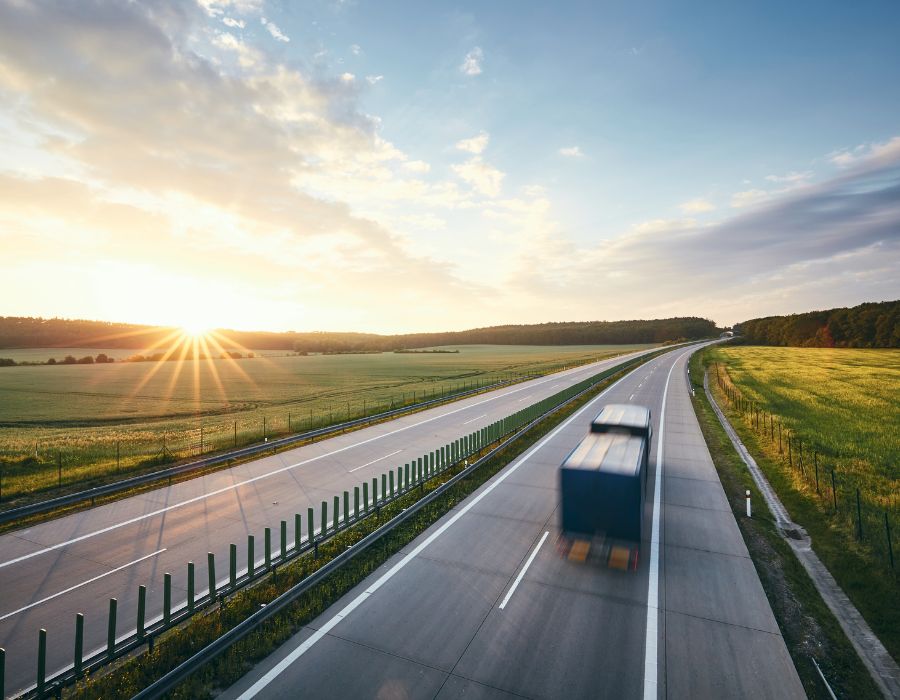 speeding delivery truck driving down highway