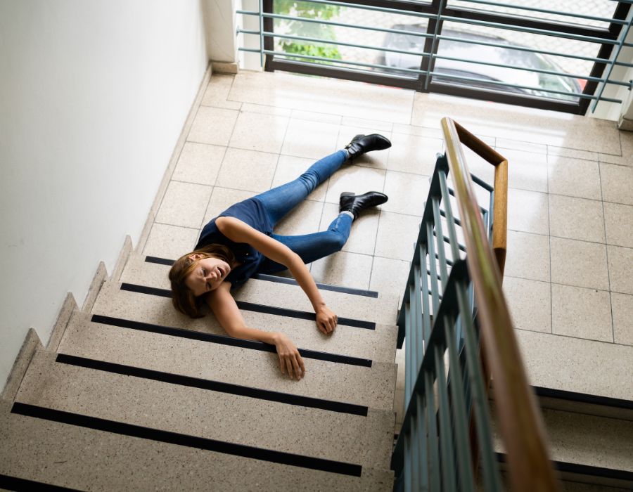 woman fallen on staircase