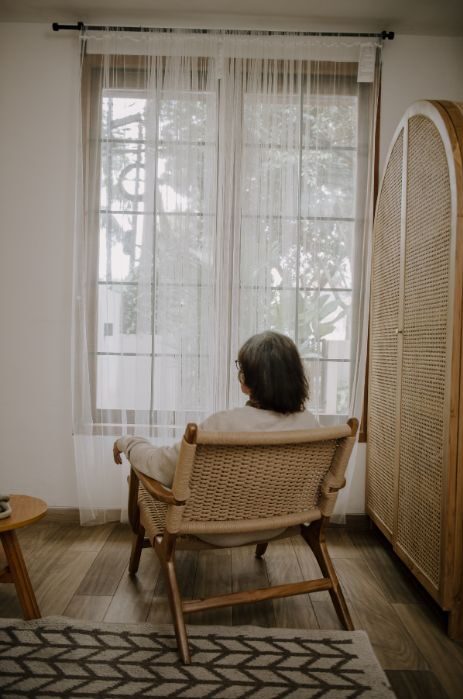 elderly looking out window