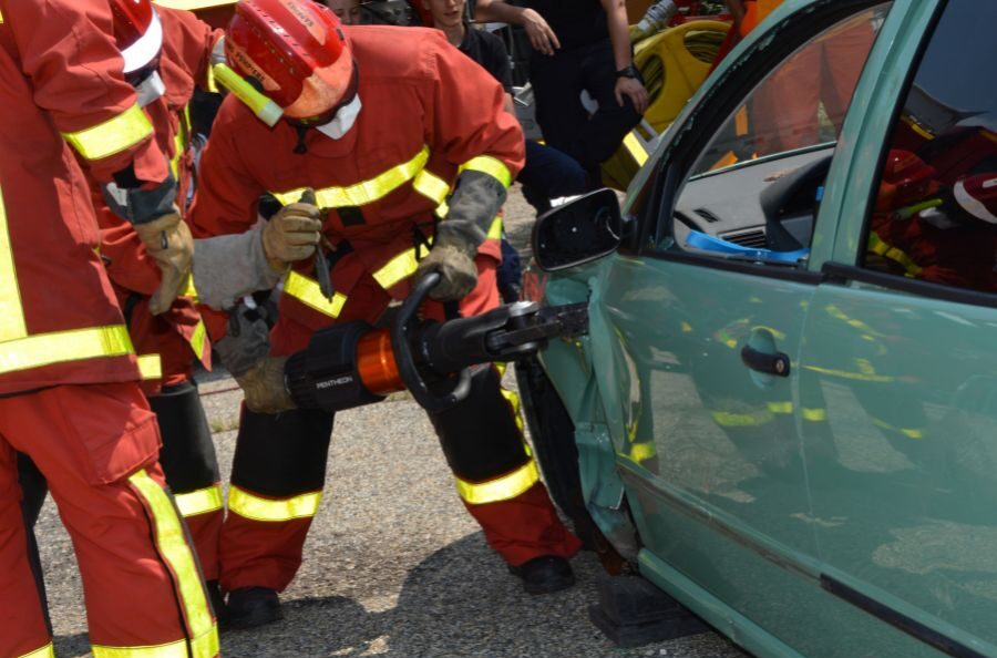 firemen prying smashed door open