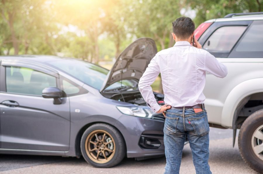 man on phone after car accident