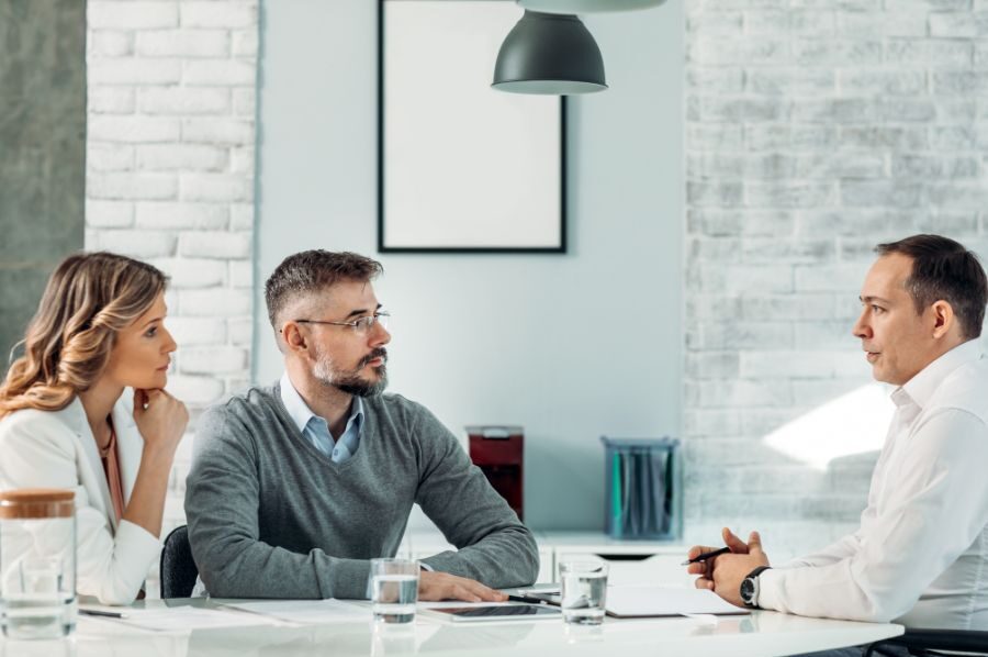 parents talking to lawyer about financial devistation