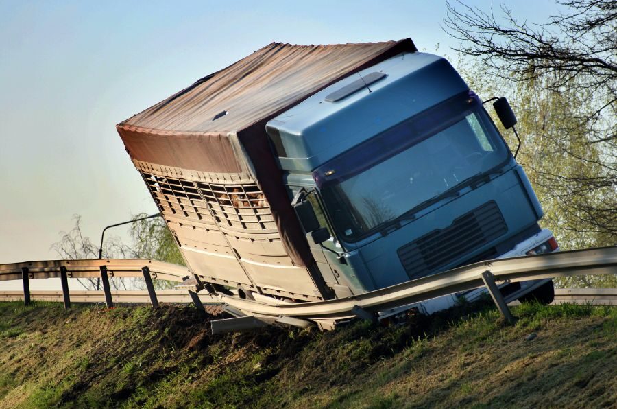 truck wrecked into guard rail on side of highway