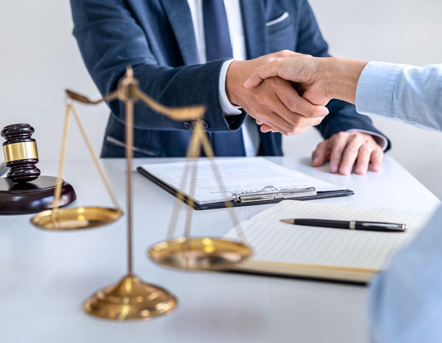 Lawyer shaking client hand