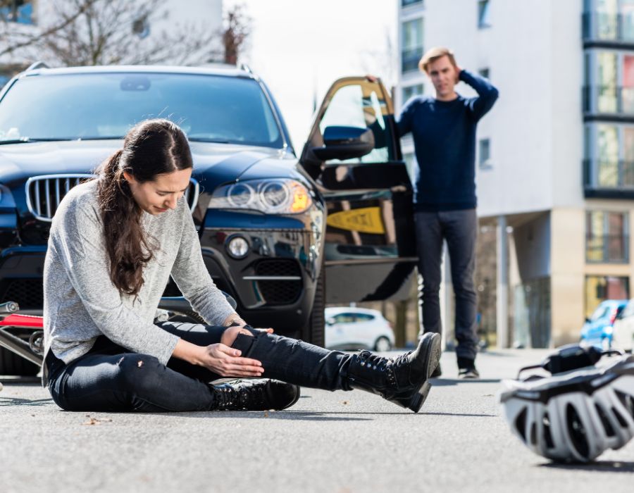 black car hit woman on bicycle