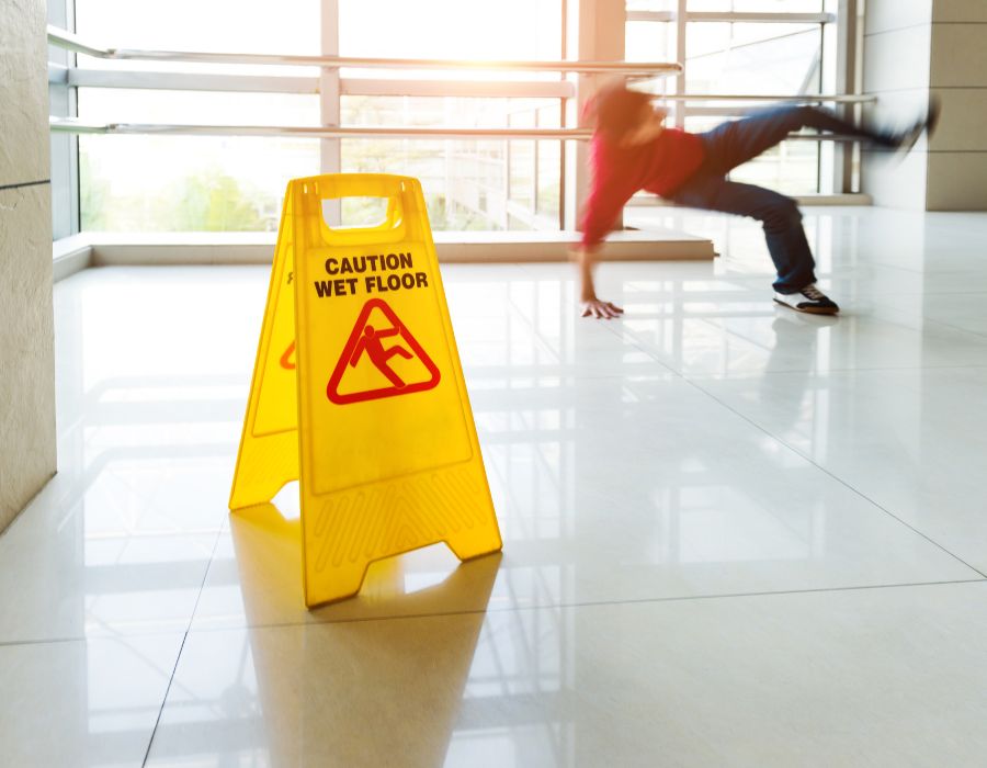 person slipping on floor near banister