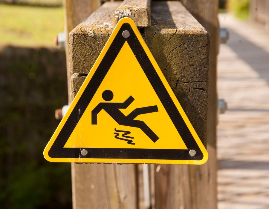 slip and fall sign on bridge