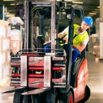 forklift operator preparing to transport object