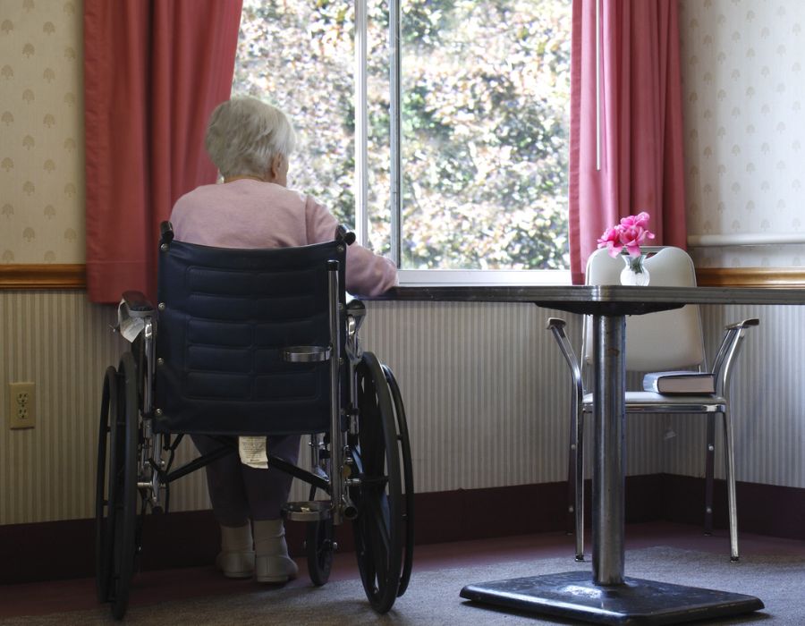 nursing home resident looking out window