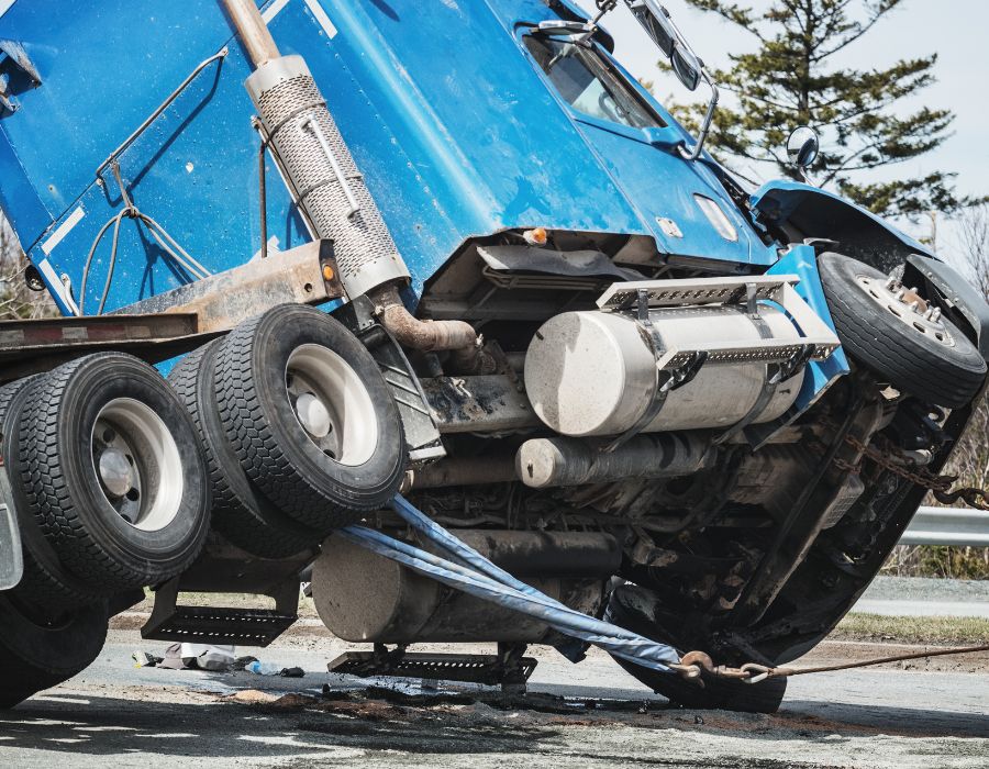 semi-truck being flipped back over after an accident