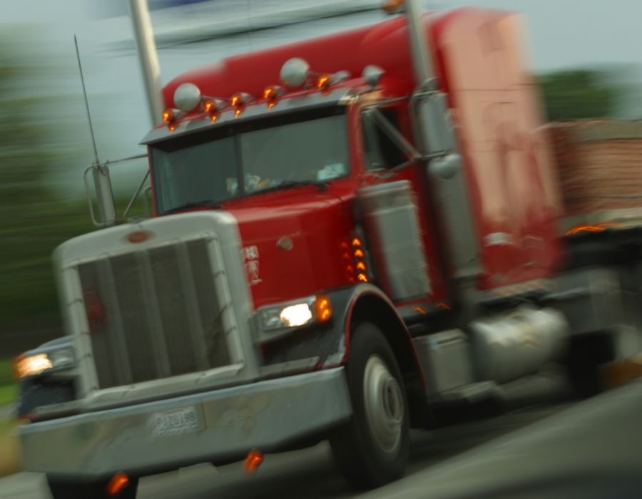 red big rig truck speeding