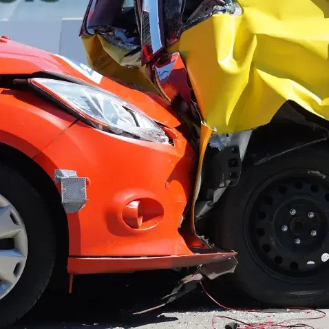 range and yellow car crashed together