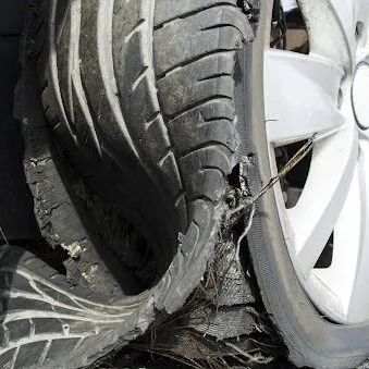 damaged tire after tire explosion at high speed on highway damaged tire after tire explosion