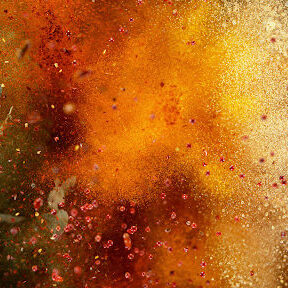 Freeze motion of various spice explosion, abstract culinary background explosion