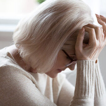 woman suffering Headache after car accident