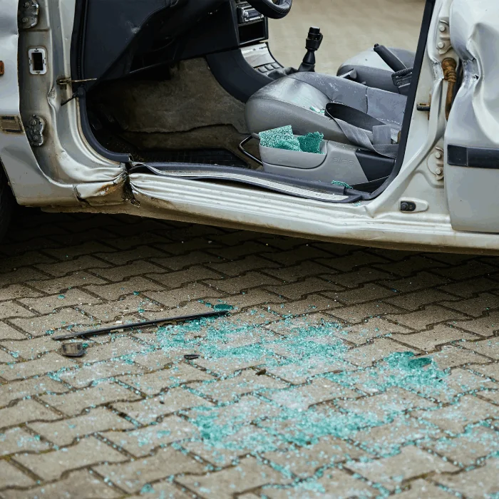 crashed van with glass on ground