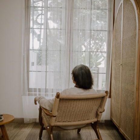 elderly looking out window