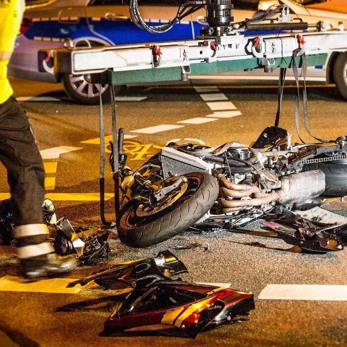 motorcycle accident with fireman cleaning up motorcycle accident with fireman cleaning up