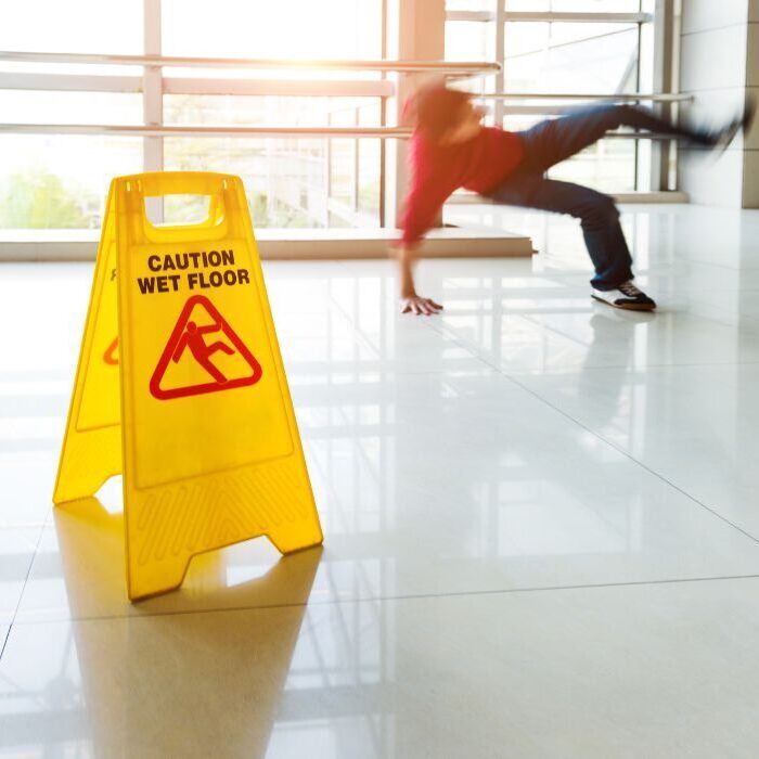 person slipping on floor near banister