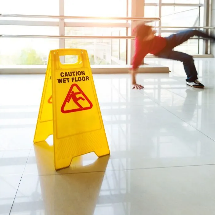 person slipping on floor near banister person slipping on floor near banister