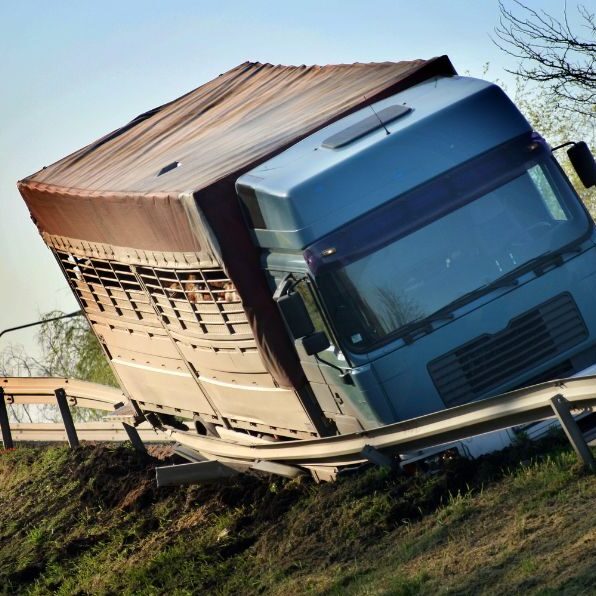 truck wrecked into guard rail on side of highway