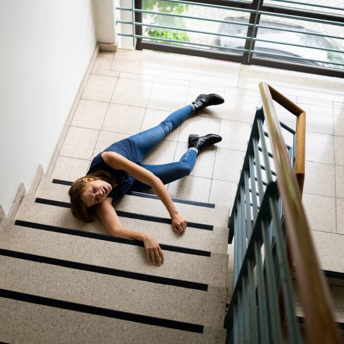 woman fallen on staircase